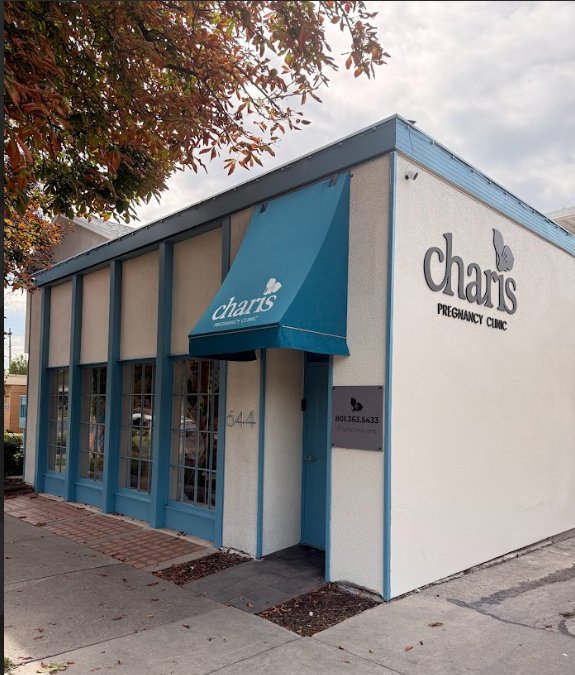 The Charis Pregnancy Clinic building, a corner storefront with a teal awning